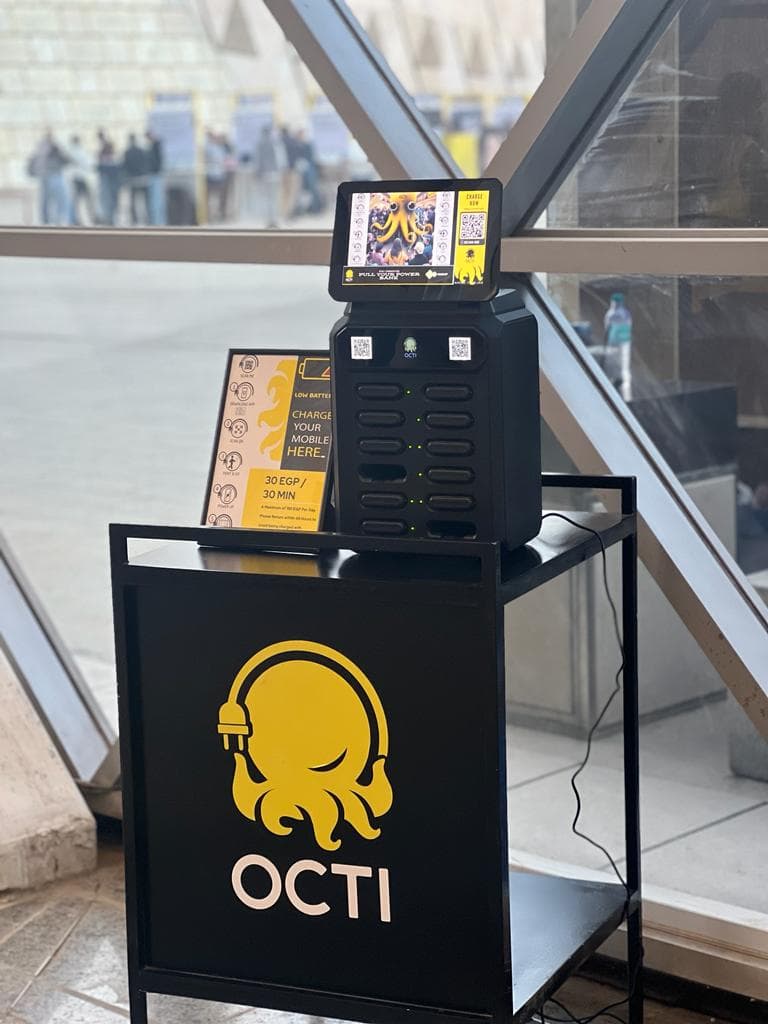 Close view of a station's lower panel carrying the octopus mascot and printed rental pricing